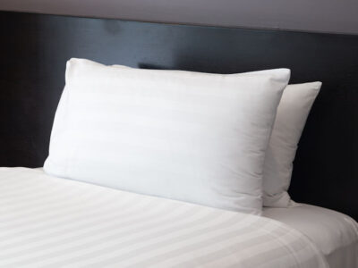 A made bed with pillows