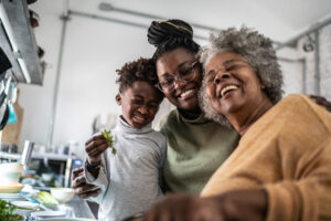 Three generations of a family enjoying cooking together