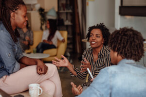 Group of three people in discussion