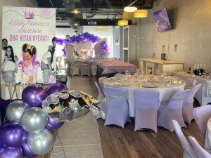 Set up for a baby shower in Venue 1944 with balloons and table settings