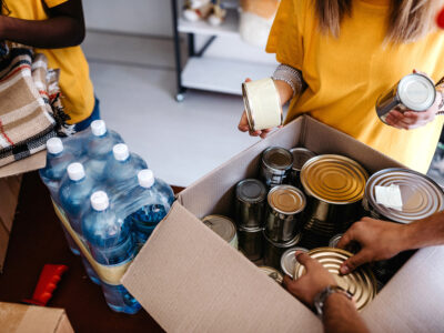 Small group of people assembling donated food