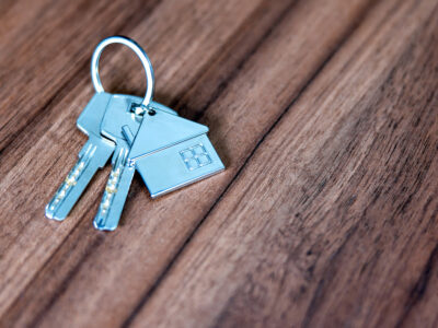 Close-up of house keys on a wooden table