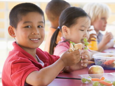 Kindergarten children eating lunch
