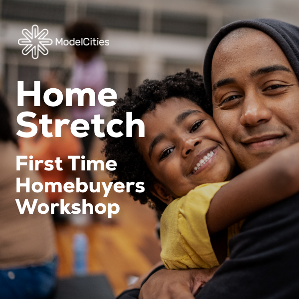 Parent with child, smiling and facing the camera